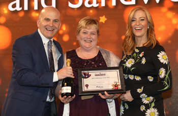 Martin Jones, managing director, Home Instead; Lynne Higgins, Caregiver of the Year; event host, Sarah-Jane Mee of Sky News.